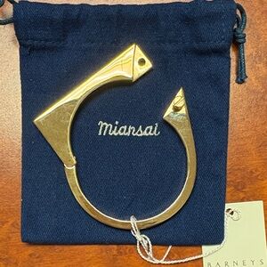 Gold tone hinged cuff bracelet